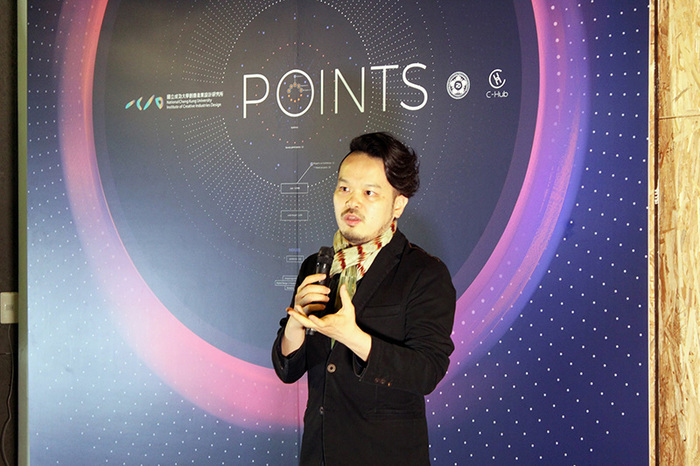 ICID Professor Yen-Ting Cho giving a brief address. Cho mentored the student organizers through their exhibit design process.